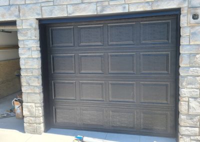 White aluminum garage doors spray painted black. Painting vinyl windows and doors is our specialty. We serve GTA and beyond